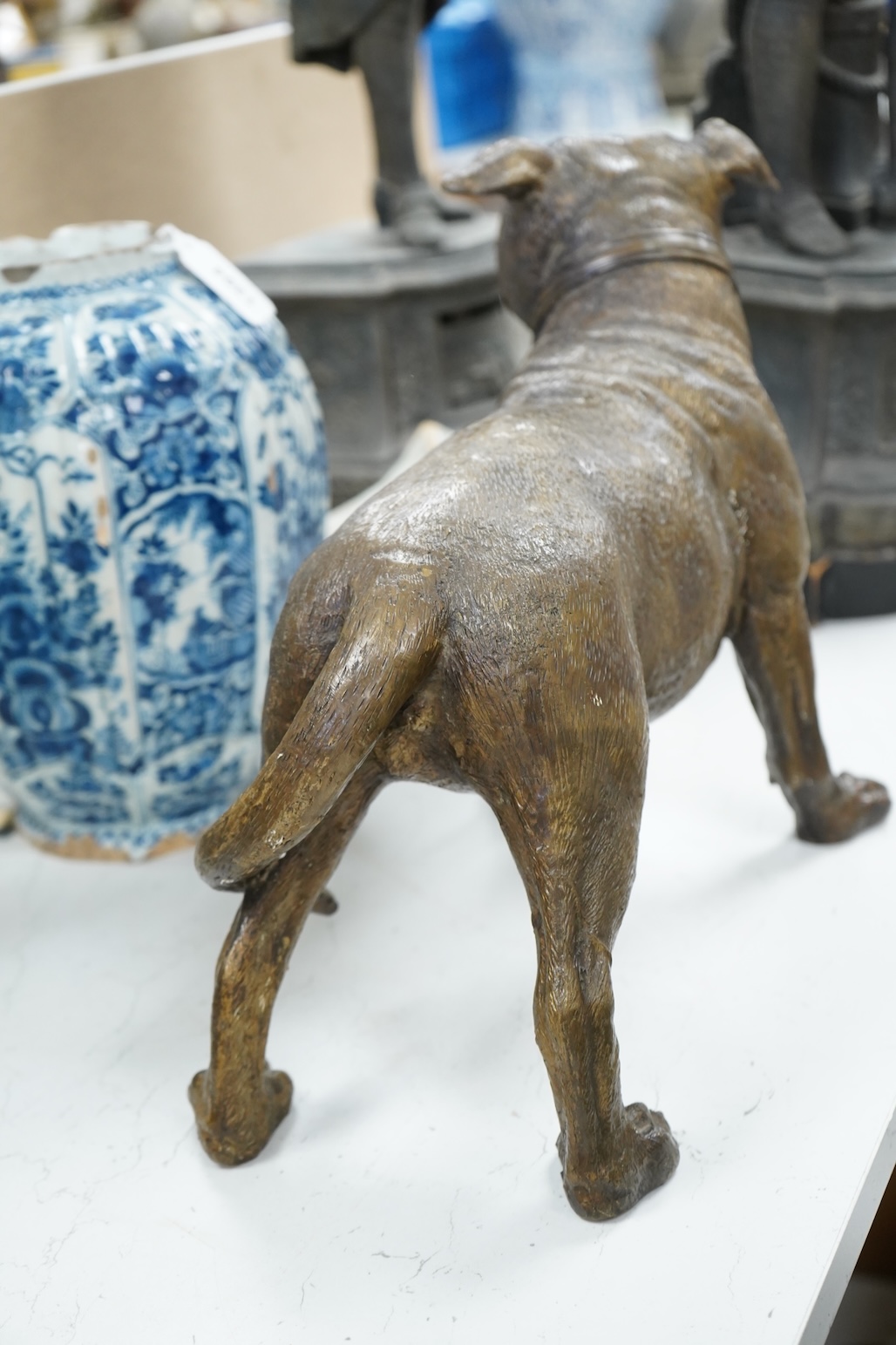 A large solid cast bronze model of a Staffordshire bull terrier, Italian, mid 20th century, signed, 45cm wide